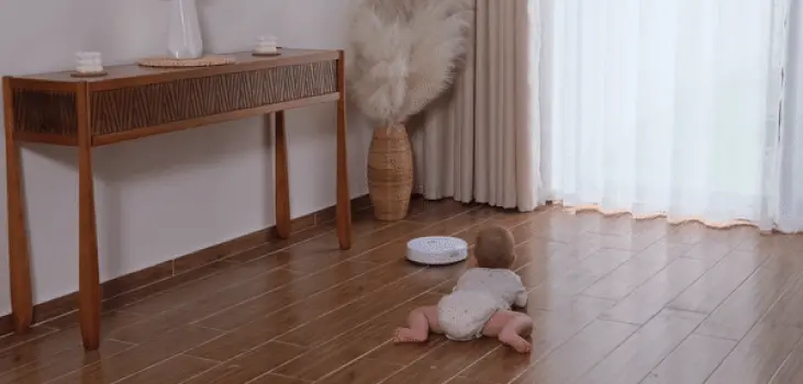 gif of baby while Robovac Pro cleaning